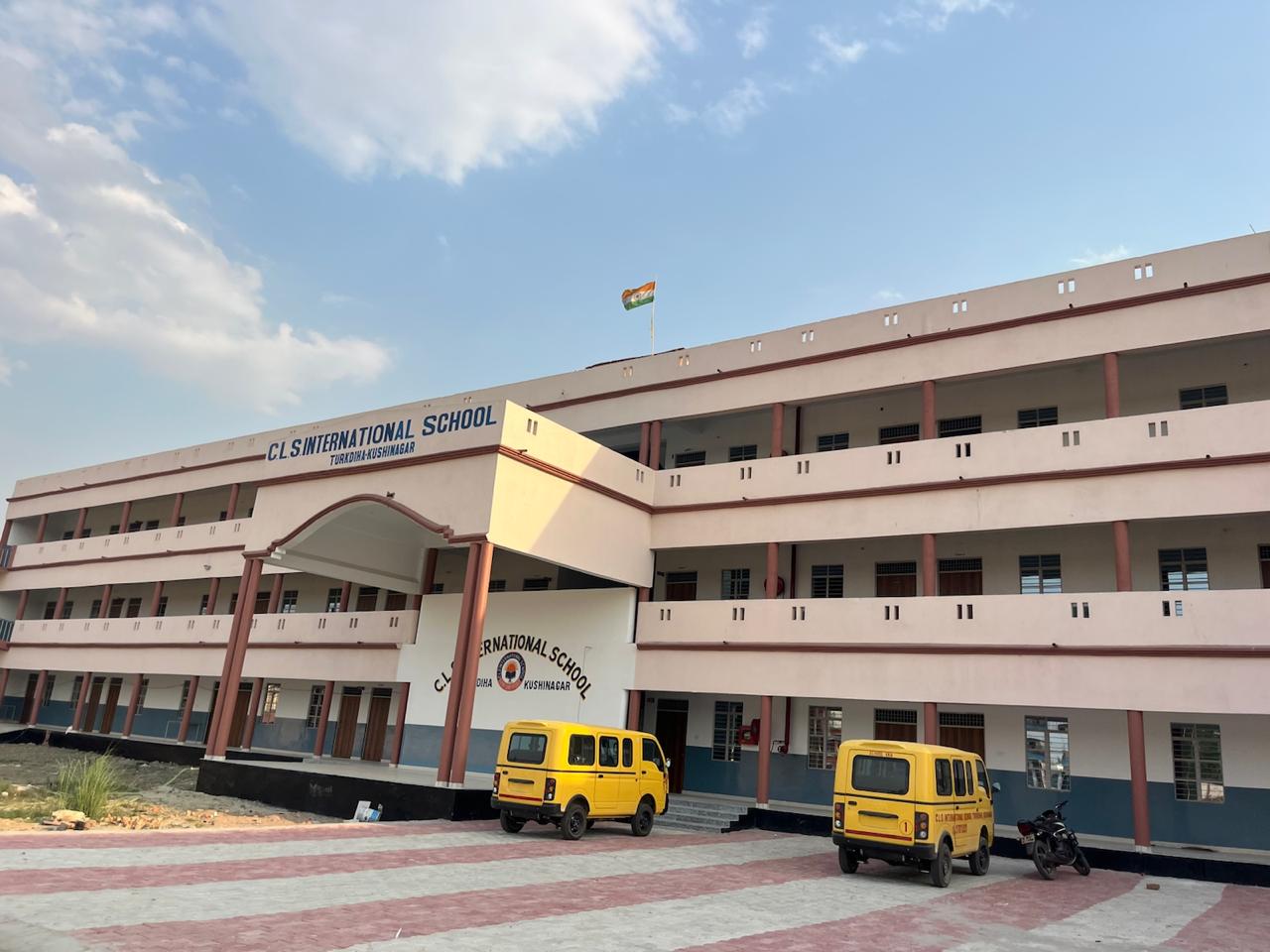 CLS International School campus with buses